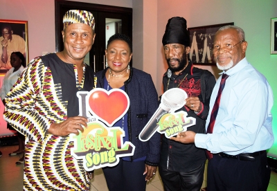 The Honourable Olivia Grange, the Minister of Culture, Gender, Entertainment and Sport with past Jamaica Festival Song Competition winners, Roy Rayon and Tinga Stewart (left to right) and Silvero Castro, Commissioner at the JCDC at the launch of the 2018 Jamaica Festival Song Competition. The event was held at The Twenty-Three Bar on Dominica Drive in New Kingston yesterday (November 30).