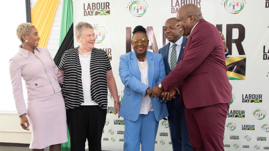 The Minister of Culture, Gender, Entertainment and Sport, the Honourable Olivia Grange (centre) shares a light moment with Minister of Labour and Social Security, the Honourable Pearnel Charles (2nd right) and Opposition Senator Floyd Morris (right) at the launch of Labour Day 2024. Also sharing the moment are Managing Director of HEART NSTA Trust, Dr Taneisha Ingleton (left) and Professor of Public Health and Ageing, the Honourable Professor Denise Eldemire-Shearer.