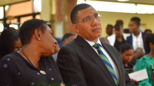 Prime Minister, the Most Hon. Andrew Holness (right), listens to Minister of Culture, Gender, Entertainment and Sport, Hon. Olivia Grange, at a ceremony to launch Workers’ Week and Labour Day 2019 activities, at the Office of the Prime Minister on Tuesday (May 7). For both events this year, focus will be placed on the safety of the nation’s children.
