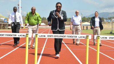 Minister of Culture, Gender, Entertainment and Sport, the Honourable Olivia Grange (centre) leads the ‘pack’ as they sample the new track at Stadium East. Others in the photograph are: Denzil Thorpe, Permanent Secretary in the Ministry; Major Desmon Brown, General Manager, Independence Park Limited; Mike Fennell, Chairman and David Shirley; Deputy Chairman, Independence Park Limited (left to right).