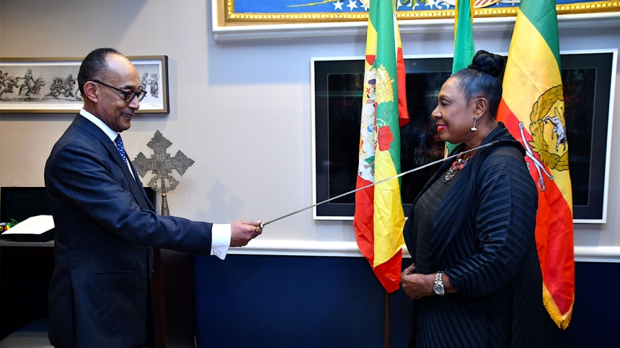 The Minister of Culture, Gender, Entertainment and Sport, the Honourable Olivia Grange (right) is made a Dame Grand Cross of the Imperial Order of the Star of Honour of Ethiopia by His Imperial Highness, The Prince Ermias at a ceremony in Washington, DC on Saturday, 4 March 2023.