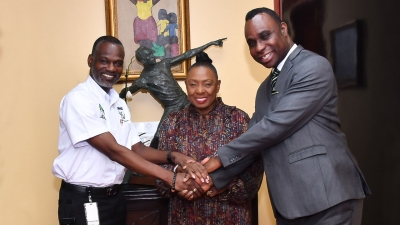 The Minister of Culture, Gender, Entertainment and Sport, the Honourable Olivia Grange, and Permanent Secretary, Denzil Thorpe, welcome Permanent Secretary, Dean-Roy Bernard, to the Ministry.