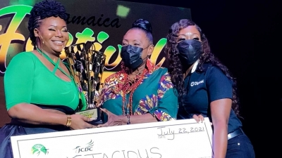 2021 Jamaica Festival Song winner, Stacious, receives the winner&#039;s trophy from the Minister of Culture, Gender, Entertainment and Sport, the Honourable Olivia Grange.