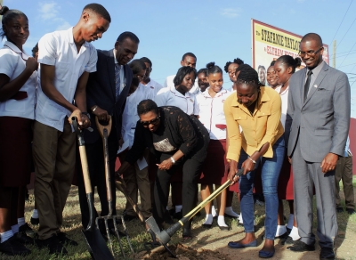 The Minister of Culture, Gender, Entertainment and Sport, the Honourable Olivia Grange (c); West Indies and Jamaican cricketer, Stafanie Taylor (second right); and President of the Jamaica Cricket Association, Billy Heaven (third left) break ground for the Stafanie Taylor Oval at the Eltham High School in St. Catherine on Wednesday (November 1). Interim Principal of the school, Ricardo Bennett (right), and students look on.
