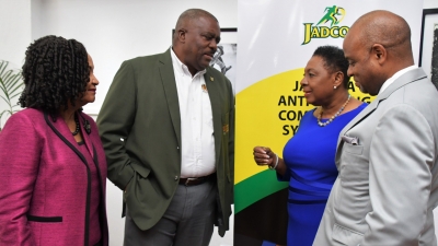 The Minister of Culture, Gender, Entertainment and Sport, the Honourable Olivia Grange (second right) in conversation with Raymond Anderson, Vice President, Jamaica Football Federation and Director, Jamaica Olympic Association (second left); June Spence-Jarrett, Executive Director, Jamaica, Anti-Doping Commission and Alexander Williams, Chairman, JADCO.  Occasion: Symposium organised by JADCO under the theme ‘Keeping Sports Clean, Forging Better Partnerships at the Jamaica Conference Centre, Downtown, Kingston.