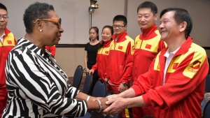 The Honourable Olivia Grange, Minister of Culture, Gender, Entertainment and Sport greets Zou Zhengqiu, gymnastics coach (right) and other members of the Chinese delegation at a function earlier today at the Jamaica Pegasus Hotel. Seven coaches, representing seven disciplines: Synchronised Swimming, Gymnastics, Swimming, Badminton, Women’s Volleyball, Women’s Football and Women’s Basketball, a team manager and an interpreter are now in Jamaica to commence year two of the Jamaica/China Technical Cooperation Project on Sport Coaching.