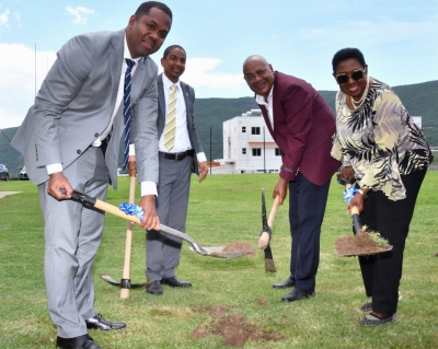 The Honourable Olivia Grange, Minister of Culture, Gender, Entertainment and Sport (right); President, Jamaica Football Federation, Michael Ricketts (second right); Development Manager, FIFA Regional Office in the Caribbean, Marlon Glean (left) and Mayor of Kingston, Senator Councillor Delroy Williams broke ground for the installation of an artificial turf at the football field at the UWI-JFF Captain Horace Burrell Centre of Excellence at the University of the West Indies on Tuesday.