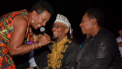 Karen Smith serenades Jimmy Cliff during the Civic Ceremony held in his honour to mark the renaming of Gloucester Avenue in Montego Bay to Jimmy Cliff Boulevard, on Thursday, March 28, 2019 at the Old Hospital Site in Montego Bay, St James. Also enjoying the moment is Minister of Culture, Gender, Entertainment and Sport, the Honourable Olivia Grange.