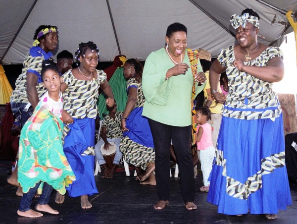  Minister of Culture, Gender, Entertainment and Sport, the Honourable Olivia Grange joins the Charles Town Maroon Council on stage as they perform at the celebration of the 280th Anniversary of the Signing of the Treaty with the British and the birthday of Captain Kojo.