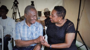 Sport Minister, Honourable Olivia Grange, shares a moment with boxing legend George Leslie &quot;Bunny&quot; Grant