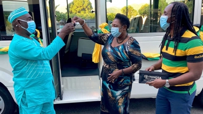 The Minister of Culture, Gender, Entertainment and Sport, the Honourable Olivia Grange (centre), presents keys to a brand new bus to the Colonel of the Accompong Town Maroons, Ferron Williams (left).  Also participating in the presentation is the Honourable Alando Terrelonge, Minister of State in the Ministry of Culture, Gender, Entertainment and Sport.