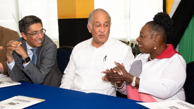 The Minister of Culture, Gender, Entertainment and Sport, the Honourable Olivia Grange (right) in conversation with Chairman of Carib Cement, Parris Lyew-Ayee (centre), and the company&#039;s Managing Director, Jorge Martinez, at the signing of an agreement for the upgrade and re-opening of the Rockfort Mineral Bath.