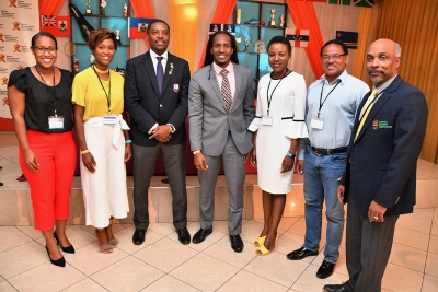 Minister of State in the Ministry of Culture, Gender, Entertainment and Sport, the Honourable Alando Terrelonge (centre); Dave Cameron, President, Cricket West Indies (3rd left) and Christopher Samuda, President, Jamaica Olympic Association (right) shared a moment with Olivia Rose Esperance, Sport Psychologist and Organiser, the 1  st Applied Sport Psychology Conference of the Caribbean (3rd right); Amanda Johnson, Sport Psychologist, Trinidad and Tobago; Marita Marshall, Physical Therapist, Barbados and Rudy Alleyne, Sport Psychologist, Barbados (left to right) at the Conference held today at the Mona Visitors’ Lodge, UWI.