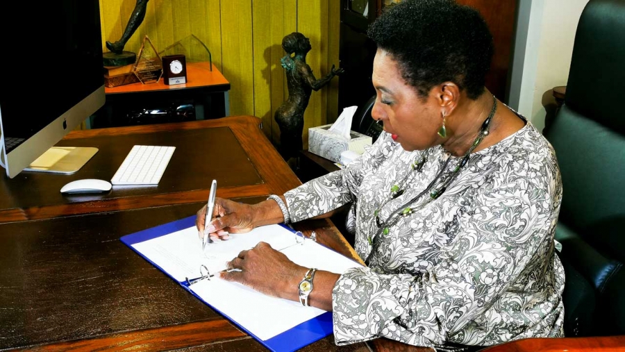 The Minister of Culture, Gender, Entertainment and Sport, the Honourable Olivia Grange, signs the Call to Action on Women&#039;s Economic Empowerment. The International initiative is being led by the US Government.