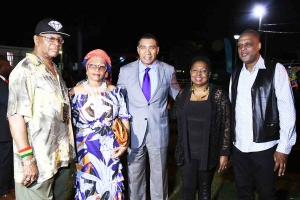 Prime Minister, the Most Hon Andrew Holness, (centre) and Minister of Culture, Hon Olivia Grange (fourth from left) share lens with from left, Copeland Forbes, tour manager, Reggae Superstar Marcia Griffiths, and radio personality Ken Williams (far right). Occasion was the Prime Minister’s reception to celebrate Reggae Month on Tuesday, February 20, on the lawns of Jamaica House.