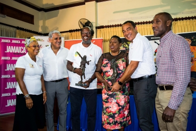 The Honourable Olivia Grange, Minister of Culture, Gender, Entertainment and Sport and Dr. the Honourable Christopher Tufton, Minister of Health, share a light moment with Reggae Marathon Sponsorship Director, Diane Ellis; Chairman, Richard Lake; Race Director, Alfred ‘Frano’ Francis and Jamdammers Running Club of Kingston President, Dr Leon Vaughn (l-r) at the Media Launch for Reggae Marathon Half Marathon &amp; 10K earlier today at the Alhambra Inn in Kingston.