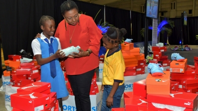 “These are for you for the INSPORTS Primary Schools Track and Field Championship for this year (2019)”, Minister Grange explains to these primary school children who will be participating in the three-day Meet which starts at the National Stadium on May 9. The Sport Minister was the keynote speaker at the launch function for the Meet at the National Indoor Sports Centre.