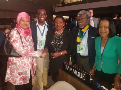 Well done, Minister! The Minister of Culture, Gender, Entertainment and Sport, the Honourable Olivia Grange (centre) is  congratulated by Madame Samira Almoosu Oman, Chairman of the Nominations Committee after Jamaica&#039;s successful election to the Executive Board of UNESCO. Also sharing the moment (L - R) are Mr O&#039;Dayne Haughton, member of the Unesco Jamaica Youth Advisory Committee; Mr Everton Hannam, Secretary-General of the Jamaican National Commission for Unesco and Her Excellency Vilma McNish, Permanent Representative to the EU and Unesco. 