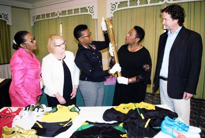 A close look is being taken at a replica of the 2012 London Olympics torch by the Honourable Olivia Grange, Minister of Culture, Gender, Entertainment and Sport (second left); Florette Blackwood, Senior Director, Sport Development and Monitoring Division in the Ministry; Janice Smith, National Sport Museum Consultant; Colleen Nattie, Conservation Officer, National Museum Jamaica and Dr Johnathon Greenland, Curator, National Museum Jamaica (left to right). The torch along with other donated items for the National Sport Museum was on display at the Textile Conservation, Preservation and Exhibition Workshop today (Wednesday) at the Knutsford Court Hotel in Kingston.