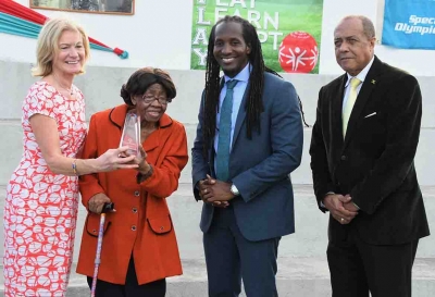Minister of State in the Ministry of Culture, Gender, Entertainment and Sport, the Honourable Alando Terrelonge (second right) with Dr Lucille Buchannan, Founder, Special Olympics Jamaica (second left); Mary Davis, CEO, Special Olympics International and Ali McNab, Chairman, Special Olympics Jamaica. Dr. Buchannan was presented with an award in recognition of her role as a founding member of the Special Olympics movement in Jamaica, yesterday (April 10) at the Special Olympics Multipurpose Court at Independence Park.