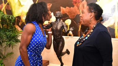 She loves it! Jamaican Olympian Veronica Campbell Brown reacts after being shown the design of the statue in her honour by the Minister of Culture, Gender, Entertainment and Sport, the Honourable Olivia Grange (right). The statue in tribute to Campbell Brown -- to the scale of one and quarter life size -- will be unveiled at Statue Park in the National Stadium complex on Sunday, 20 October 2019.