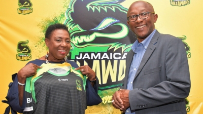 “Cricket lovely cricket”. A delighted Honourable Olivia Grange,  Minister of Culture, Gender, Entertainment and Sport, is presented with  a Jamaica Tallawahs shirt  by Mr Jefferson Miller, Chief Executive Officer,  Jamaica Tallwahs, at a news conference at the Jamaica Pegasus today (May 4).  Minister Grange announced a total of $12M dollars support from the  Government for the Tallawahs for the upcoming Caribbean Premier League Season.