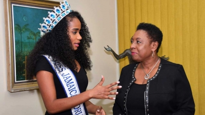 The Minister of Culture, Gender, Entertainment and Sport, the Honourable Olivia Grange, in discussion with Toni-Ann Singh