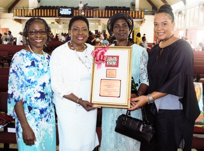 The Honourable Olivia Grange, Minister of Culture, Gender, Entertainment and Sport with Sylvia Henry, President of the Jamaica Baptist Women’s Federation (second right); Dr Zoe Simpson (left), Executive Director, Women’s Centre of Jamaica Foundation (WCJF) and Debby-Ann Brown Salmon, Board Chairman, WCJF (right). A plaque was presented to the Jamaica Baptist Women’s Federation for their contribution to the Women’s Centre programme for adolescent mother. 