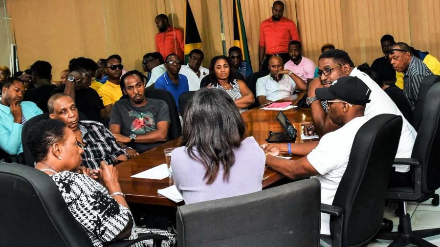 The Minister of Culture, Gender, Entertainment and Sport, the Honourable Olivia Grange (left) in discussion with stakeholders in the entertainment industry at her offices in New Kingston on 9 September 2019.