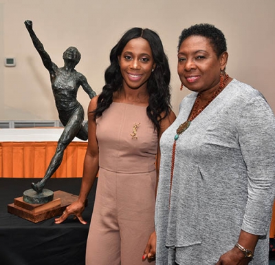The Honourable Olivia Grange, Minister of Culture, Gender, Entertainment and Sport with Olympian Shelly-Ann Fraser-Pryce, following the unveiling of the maquette of the statue that will be mounted in her honour at Statue Park in October.