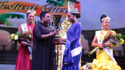The Minister of Culture, Gender, Entertainment and Sport, the Honourable Olivia Grange, presents winning trophy to Miss Jamaica Festival Queen 2019, Khamara Wright.  Also pictured are 1st Runner Up AnnaKay Hudson (left) and 2nd Runner Up Chardonnae Parkins.