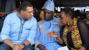Minister of Culture, Gender, Entertainment and Sport, the Honourable Olivia Grange (right) in conversation with Prime Minister, the Most Honpourable Andrew Holness (left) and Colonel Ferron Williams of the Accompong Maroons at the celebration of the 281st signing of the Treaty with the British and the birthday of Captain Kojo in Accompong Town, St Elizabeth on Sunday, January 6.