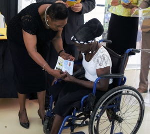  Minister of Culture, Gender, Entertainment and Sport, the Honourable Olivia Grange, presented Claire Reid with her Culture Passport at the Symbolic Signing between the Ministry and CHASE Fund for the expansion of the Culture Club Programme today (Wednesday) at the Devon House Heritage Site. Senior Citizens are now one of the groups to which the Culture Passport is being made available.