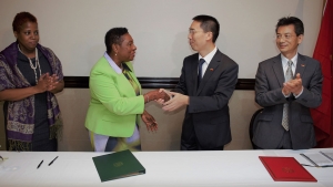 A handshake to seal the deal. The Honourable Olivia Grange, Minister of Culture, Gender, Entertainment and Sport and His Excellency, Niu Qingbao, Ambassador of the People’s Republic of China to Jamaica signed a Letter of Exchange sealing a technical cooperation project on sports which will see the provision of Chinese coaches for seven sporting disciplines in Jamaica. Supporting the Minister is Dr. Janice Lindsay, Acting Permanent Secretary in the Ministry (left), while Fan Jianghong, Counsellor, Economic and Commercial Counsellor Office, People’s Republic of China Embassy accompanied the Ambassador (right). The signing took place at the Jamaica Pegasus.