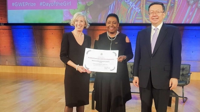 Minister of Culture, Gender, Entertainment and Sport, the Honourable Olivia Grange (centre) accepts the UNESCO Prize for Girls’ and Women’s Education on behalf of the Women’s Centre of Jamaica Foundation from UNESCO Assistant Director-General for Education, Stefania Giannini, on Thursday (11 October 2018).  Also pictured is Vice Minister of Education of China and Chair of the Chinese Commission for UNESCO, Tian Xuejun.  The prize is sponsored by the People&#039;s Republic of China.
