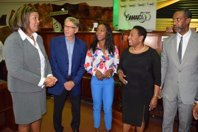 The Minister of Culture, Gender, Entertainment and Sport, the Honourable Olivia Grange, pays keen attention to Lilyclaire Bellamy, Executive Director of the Jamaica Intellectual Property Office (left) as she gives a preview of her topic at the Inter-Regional Conference on the Strategic Use of Intellectual Property in Sport, which opened at the Jamaica Conference Centre in Downtown, Kingston this morning (September 19). Minister Grange was the keynote speaker at the Opening Ceremony. Others in the photograph are presenters Jim Bagshaw, Retired, Vice President, Marketing, Sponsorship and Advertising Calgary Flames and Olympian Veronica Campbell-Brown as well as Chris Stokes, 1st Vice President, Jamaica Olympic Association (l-r).