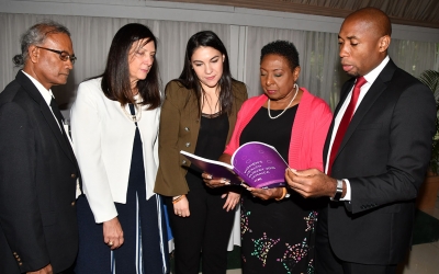 The Honourable Olivia Grange, Minister of Culture, Gender, Entertainment and Sport (second right) reads a section of the Jamaica Women’s Health Survey which was launched at the Terra Nova Hotel today, June 21. Also Photographed are: Easton Williams, Senior Director, Social Policy Planning and research Division, Planning Institute of Jamaica and Chair of National Steering Committee; Luiza Carvalho, Regional Director, Americas and the Caribbean, UN Women; Camila Mejia Giraldo, Modernisation of the State Specialist, Inter-American Development Bank and Rohan Richards, Chief Technical Director, Ministry of National Security (left to right).